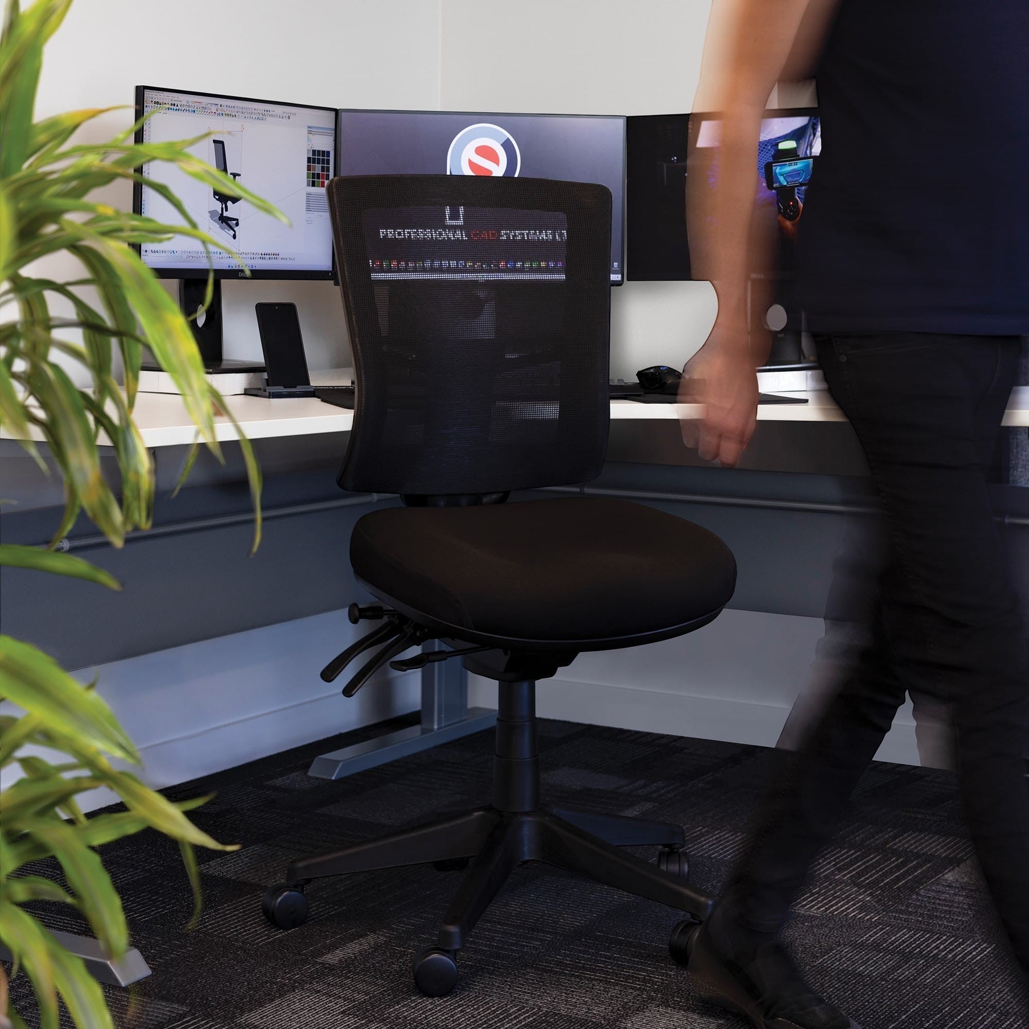 Buro Metro II 24/7 chair in a modern corporate office setting with multi-monitor desks.