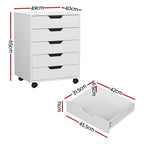 Technical diagram detailing the overall height, width, and depth dimensions of the white 5-drawer storage cabinet.