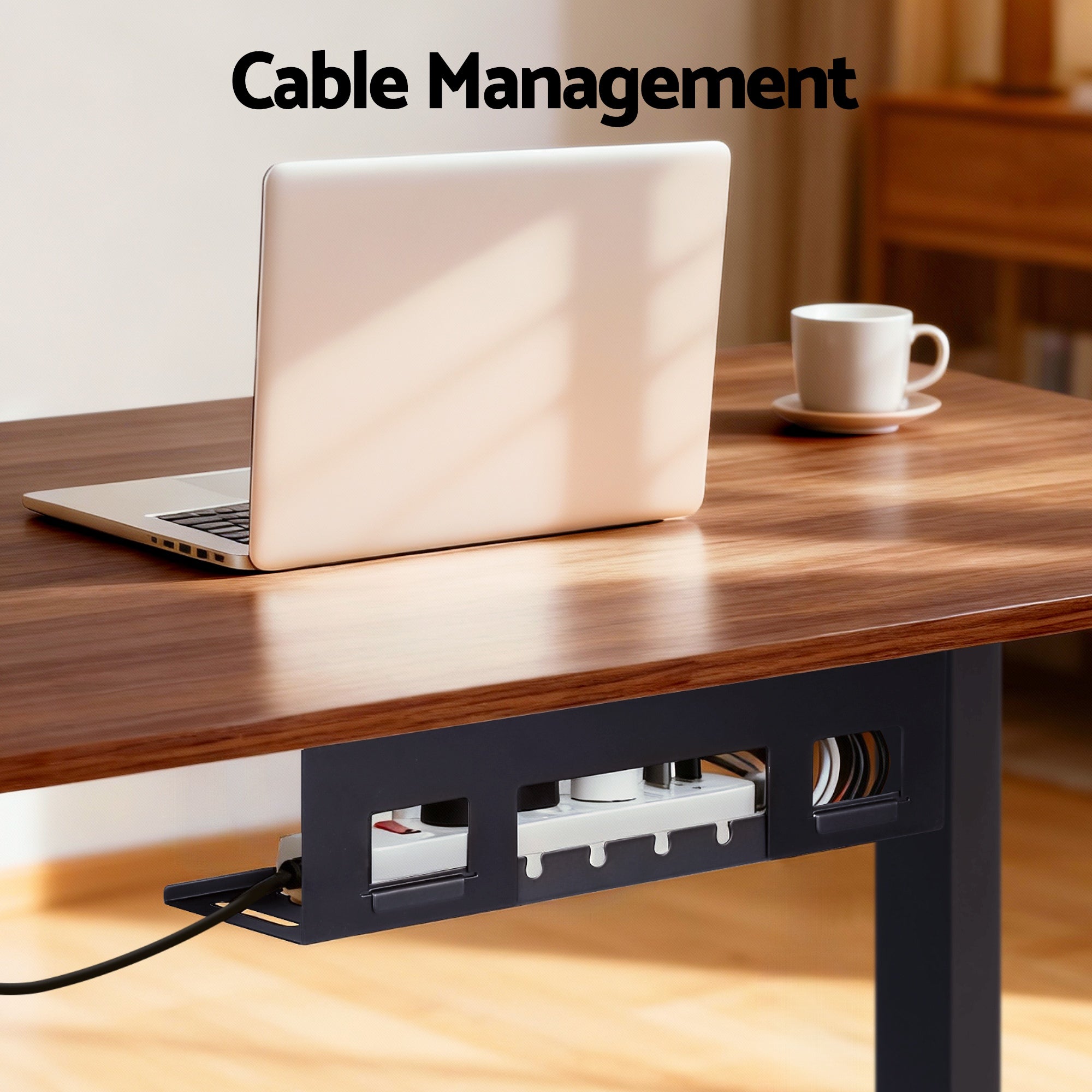 Integrated under-desk cable management tray keeping cords neatly organized on a walnut standing desk.