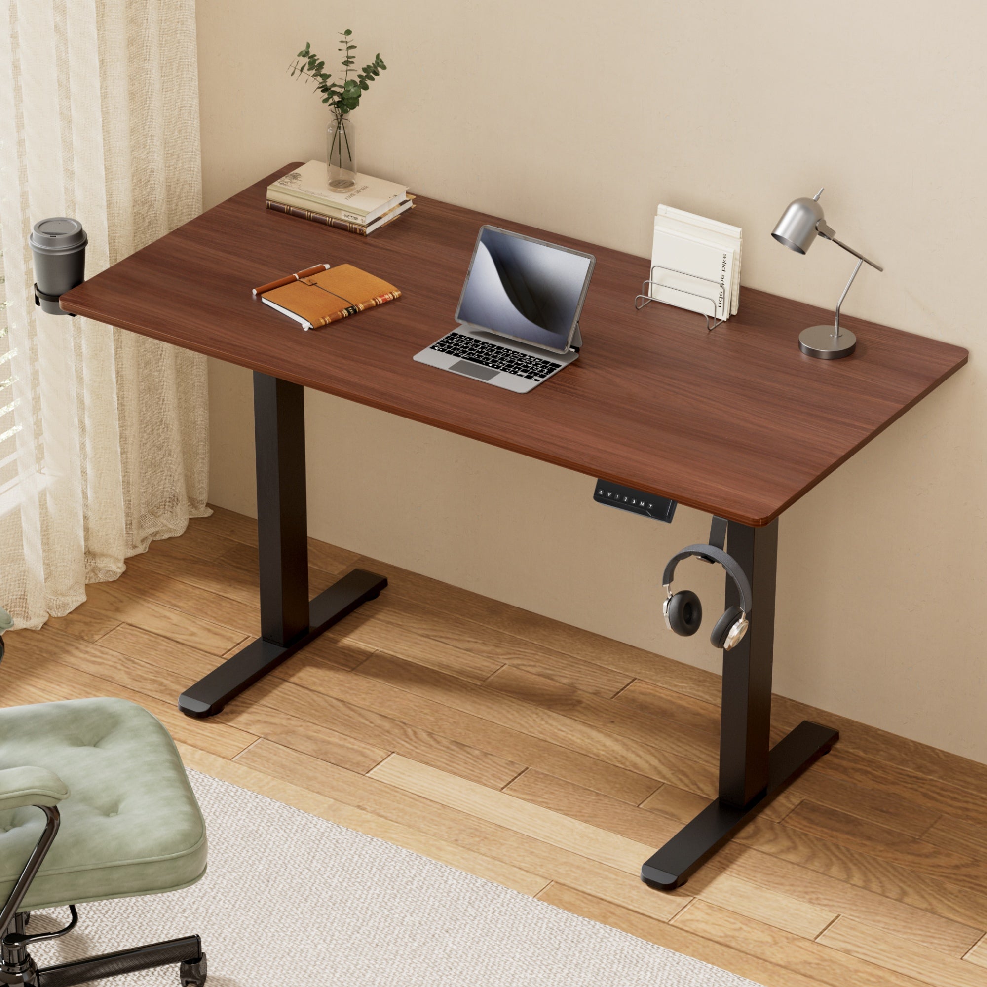Studio Executive Walnut electric standing desk featured in a modern, minimalist home office setup.