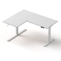 Angled front view of the motorised L-shaped standing desk featuring a clean white desktop and matching white frame.