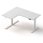 Angled front view of the motorised L-shaped standing desk featuring a clean white desktop and matching white frame.