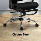 Close-up detail showing the heavy-duty chrome base and smooth-rolling caster wheels of the reclining desk chair.