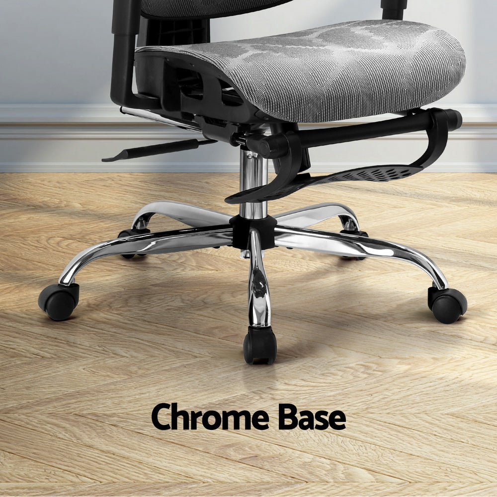 Close-up detail showing the heavy-duty chrome base and smooth-rolling caster wheels.
