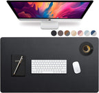 Top-down view of the Studio Executive black PU leather desk protector mat holding a keyboard, mouse, and coffee.