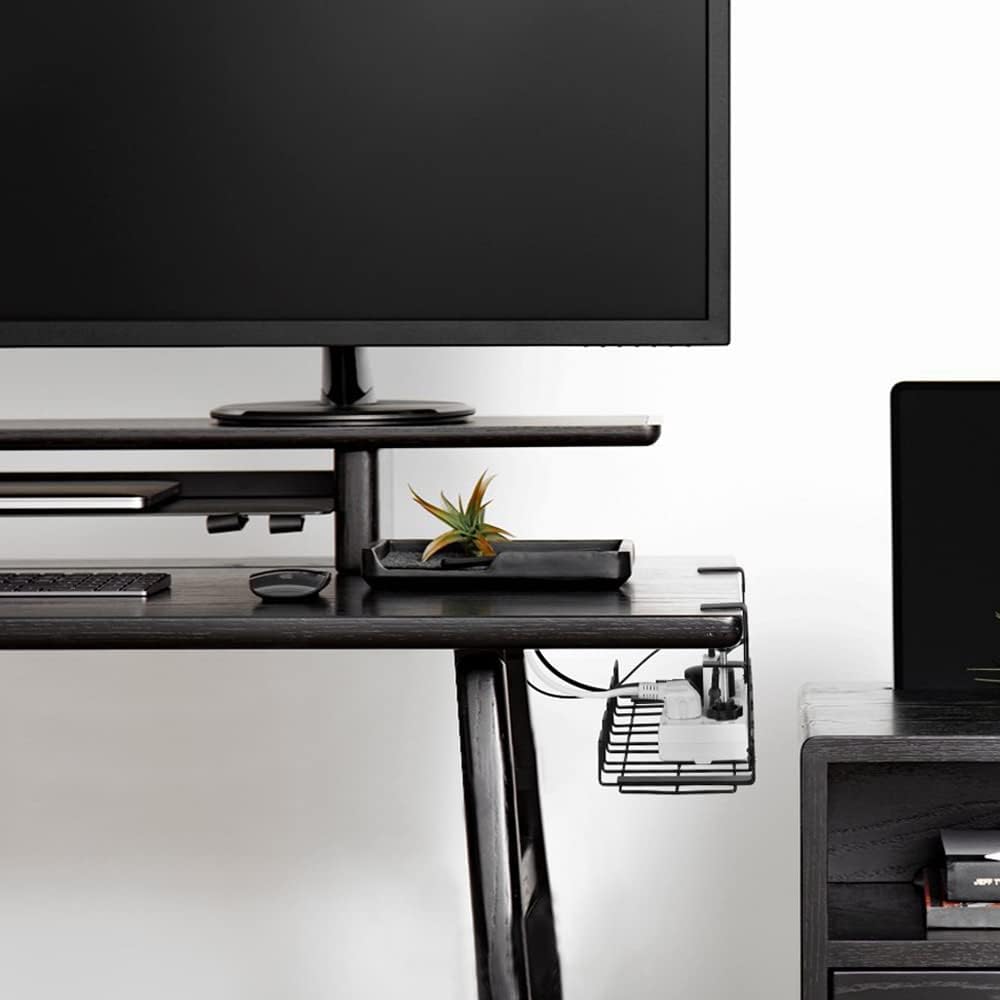 Under-desk view of the black cable management tray securely hiding power bricks and cords on a modern standing desk.
