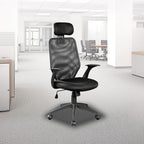 Black Studio V63 performance desk chair set up in a bright, modern professional office workspace.