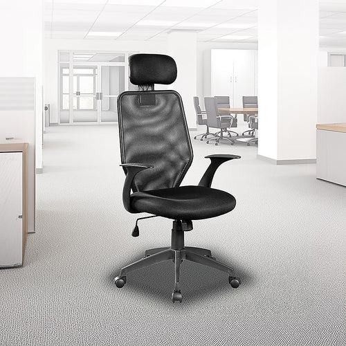 Black Studio V63 performance desk chair set up in a bright, modern professional office workspace.