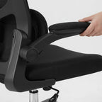 Cloud Office Studio ergonomic black mesh office chair with 3D adjustable armrest being positioned by a hand