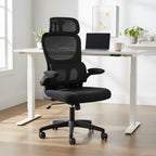 Cloud Office Studio ergonomic black mesh office chair with lumbar support and headrest in a modern home office setting