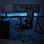 Cloud Office Studio black mesh executive chair with adjustable headrest and retractable footrest for ergonomic support.