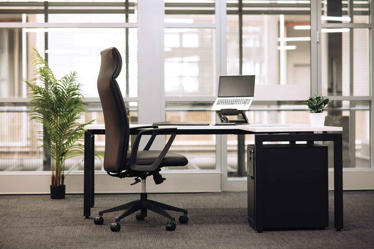 Cloud Office Studio black 3-drawer mobile pedestal under a modern office desk with an ergonomic chair