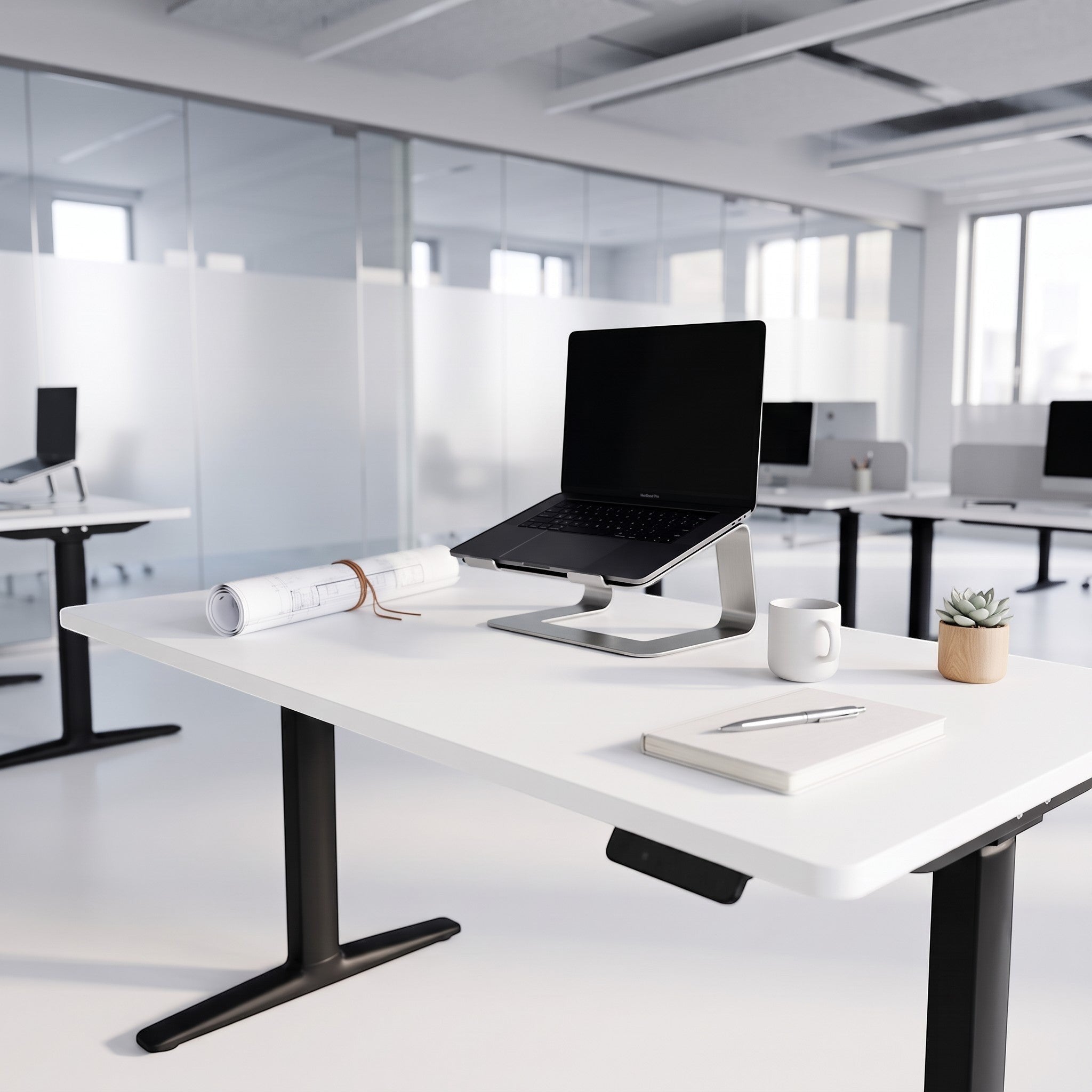 Cloud Office Studio Buro Syntra heavy-duty dual-motor standing desk with white top and black legs in modern office