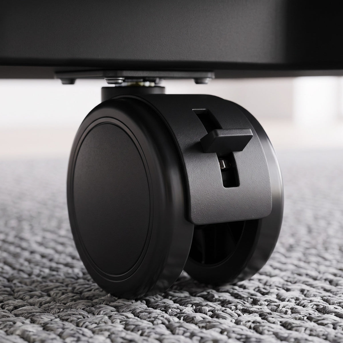 Cloud Office Studio Buro mobile pedestal black locking castor wheel detail on a grey carpeted floor