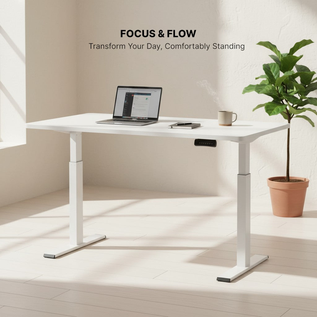 Cloud Office Studio white dual-motor standing desk with a 140cm matte white desktop, laptop, and mug.